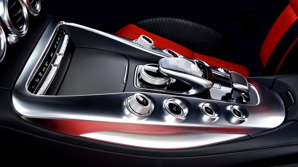 Red RC car on pavement ready to race